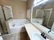 Bathroom with bathtub and vanity and view to the shower at 500 Wellesly St, Oviedo, FL 32765