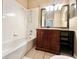 Bathroom with a tub and shower head combo at 500 Wellesly St, Oviedo, FL 32765