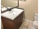 Bathroom featuring a vanity with a countertop, drawers, and tile flooring at 500 Wellesly St, Oviedo, FL 32765