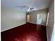 Spacious primary bedroom with ceiling fan and ensuite bathroom access at 500 Wellesly St, Oviedo, FL 32765