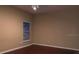 Spacious bedroom featuring a ceiling fan, window with blinds, and wood-look flooring at 500 Wellesly St, Oviedo, FL 32765