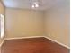 Bedroom featuring a ceiling fan, window with blinds, and wood-look flooring at 500 Wellesly St, Oviedo, FL 32765
