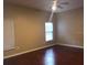 Bedroom with wood flooring, natural light, and a ceiling fan at 500 Wellesly St, Oviedo, FL 32765