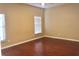 Bedroom with multiple windows that offer natural light and wood-look flooring at 500 Wellesly St, Oviedo, FL 32765