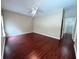 Bedroom with ceiling fan and view to the hallway with white door at 500 Wellesly St, Oviedo, FL 32765