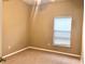 Neutral bedroom with a ceiling fan and a bright window at 500 Wellesly St, Oviedo, FL 32765