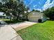 Landscaped front yard and attached two-car garage at 500 Wellesly St, Oviedo, FL 32765