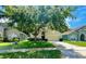 Charming single-Gathering home featuring a lush, green front yard and a well-maintained lawn at 500 Wellesly St, Oviedo, FL 32765