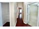 Hallway with wood floors and views to other rooms at 500 Wellesly St, Oviedo, FL 32765