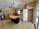 Open concept kitchen with stainless steel appliances and a kitchen island at 500 Wellesly St, Oviedo, FL 32765