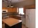 Kitchen featuring light wood cabinets, stainless steel appliances, and a kitchen island at 500 Wellesly St, Oviedo, FL 32765