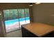 Kitchen with an island and sliding glass doors that offer views of the outdoor swimming pool at 500 Wellesly St, Oviedo, FL 32765