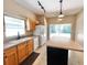 Bright kitchen with a double sink, stainless steel appliances, and a large island at 500 Wellesly St, Oviedo, FL 32765