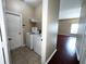 Laundry room with white washer and dryer units at 500 Wellesly St, Oviedo, FL 32765