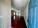 Open concept living room with shiny hardwood floors at 500 Wellesly St, Oviedo, FL 32765