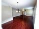 Spacious living room with hardwood floors and hanging lights at 500 Wellesly St, Oviedo, FL 32765