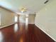 Bright and open living room with ceiling fan and hardwood floors at 500 Wellesly St, Oviedo, FL 32765