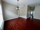 View of the living room area featuring wood flooring and neutral paint at 500 Wellesly St, Oviedo, FL 32765