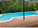Outdoor pool and patio area with screened enclosure at 500 Wellesly St, Oviedo, FL 32765