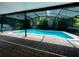 Tranquil screened pool with brick patio for outdoor enjoyment at 500 Wellesly St, Oviedo, FL 32765