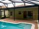 Relaxing pool area with brick patio and screened enclosure at 500 Wellesly St, Oviedo, FL 32765