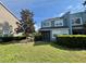 Backyard featuring a lawn, mature tree, patio and lush landscaping at 506 Terrace Spring Dr, Orlando, FL 32828