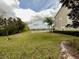 Expansive backyard with well-maintained lawn and water view at 506 Terrace Spring Dr, Orlando, FL 32828