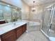 Bathroom featuring double sinks, a soaking tub, and a separate shower at 506 Terrace Spring Dr, Orlando, FL 32828