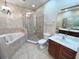Bathroom with a luxurious tub, a separate shower, and double vanities at 506 Terrace Spring Dr, Orlando, FL 32828