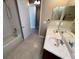 Bathroom with double sinks, tiled floors and shower-tub combo at 506 Terrace Spring Dr, Orlando, FL 32828