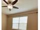 Bedroom with a ceiling fan, window and neutral walls at 506 Terrace Spring Dr, Orlando, FL 32828