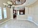 Dining area with tile flooring, a modern chandelier, and an open view of the kitchen at 506 Terrace Spring Dr, Orlando, FL 32828