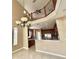 Dining area with tile flooring, an elegant chandelier, and an open view of the kitchen at 506 Terrace Spring Dr, Orlando, FL 32828