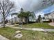 Attractive townhome exteriors with attached garages, landscaping, and sidewalks at 506 Terrace Spring Dr, Orlando, FL 32828