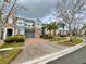 Charming townhome with a brick driveway, a garage, and colorful exterior paint at 506 Terrace Spring Dr, Orlando, FL 32828