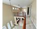 Bright open concept home with neutral carpet, tile floors, and staircase with wrought iron railing at 506 Terrace Spring Dr, Orlando, FL 32828