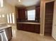 Kitchen boasts granite counters, wood cabinets, and an open pantry at 506 Terrace Spring Dr, Orlando, FL 32828