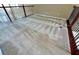 Spacious loft area featuring neutral carpeting and a decorative railing at 506 Terrace Spring Dr, Orlando, FL 32828