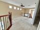 Spacious loft area featuring neutral carpet, abundant natural light, and a ceiling fan for added comfort at 506 Terrace Spring Dr, Orlando, FL 32828
