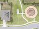 Aerial view shows the home's roof with solar panels and nearby playground at 561 Andrea S Cir, Haines City, FL 33844