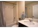 Clean bathroom featuring a shower-tub combination, large vanity, and modern fixtures at 561 Andrea S Cir, Haines City, FL 33844