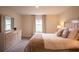 Serene bedroom showcasing a plush bed, dresser, and window for a tranquil retreat at 561 Andrea S Cir, Haines City, FL 33844