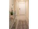 Stylish entryway with tile flooring, a console table, and a view to the front door at 561 Andrea S Cir, Haines City, FL 33844