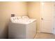 Convenient laundry area featuring a modern washer and dryer set for efficient laundry care at 561 Andrea S Cir, Haines City, FL 33844