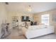 Bright living room with tile flooring, a sectional sofa, modern decor, and a large window at 561 Andrea S Cir, Haines City, FL 33844