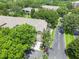 Aerial view of property highlighting the landscaping and proximity to roads at 6453 Alcalde Ct # 110, Orlando, FL 32835