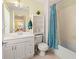 Bright bathroom with a vanity, storage, and a shower-tub combination at 6453 Alcalde Ct # 110, Orlando, FL 32835