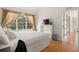 Cozy bedroom with a large window and natural light, plus sliding glass door to the patio at 6453 Alcalde Ct # 110, Orlando, FL 32835