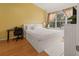 Well-lit bedroom with large window, a work desk, and neutral walls at 6453 Alcalde Ct # 110, Orlando, FL 32835