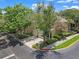 Beautiful townhome featuring a two-car garage, manicured landscaping, and a corner lot location at 6453 Alcalde Ct # 110, Orlando, FL 32835